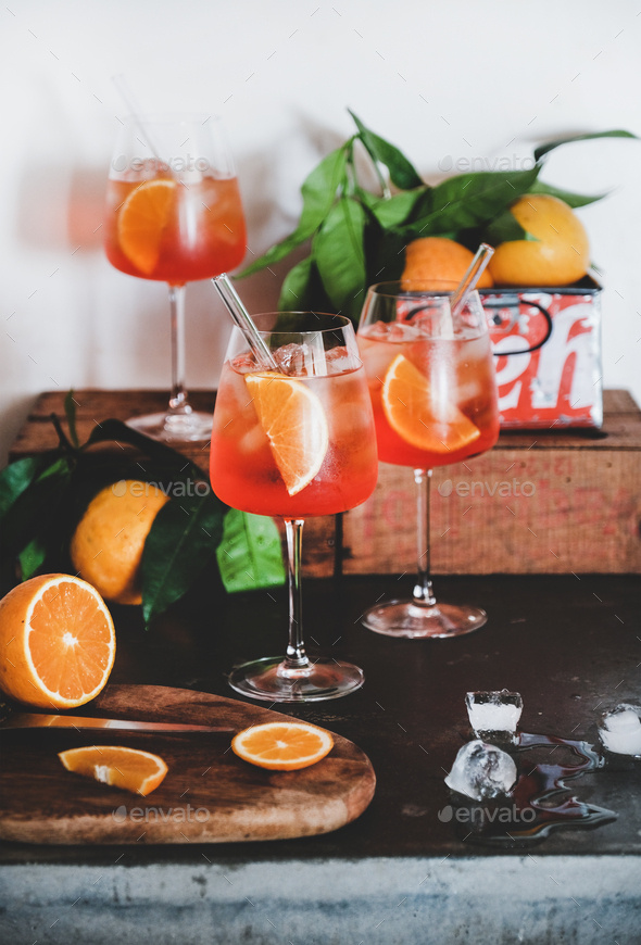 Aperol Spritz aperitif drink in glasses with oranges and ice - Stock Photo - Images