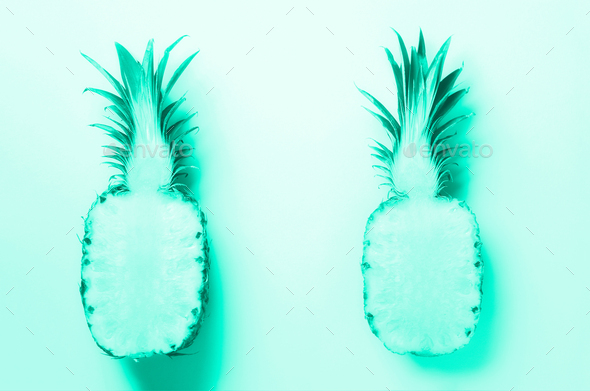 Half of sliced pineapple on mint color background. Top View. Bright pattern for minimal style - Stock Photo - Images
