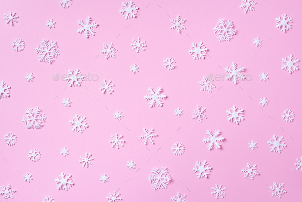 Winter pattern made of white snowflakes on pink background. Top ...
