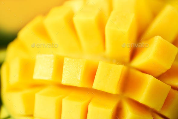 Exotic mango fruit over tropical green palm leaves on yellow background. Copy space. Pop art design - Stock Photo - Images