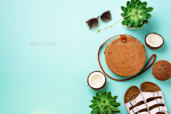 Stylish rattan bag, coconut, birkenstocks, succulent, sunglasses on blue background. Banner. Top - Stock Photo - Images