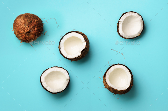 Pattern with ripe coconuts on blue background. Top View. Copy Space. Pop art design, creative summer - Stock Photo - Images