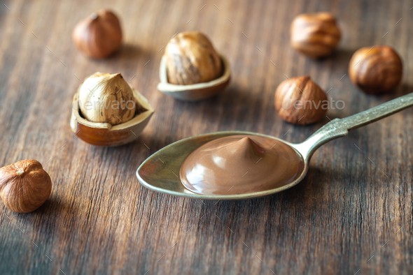 Wooden spoon of peanut butter Stock Photo by Alex9500