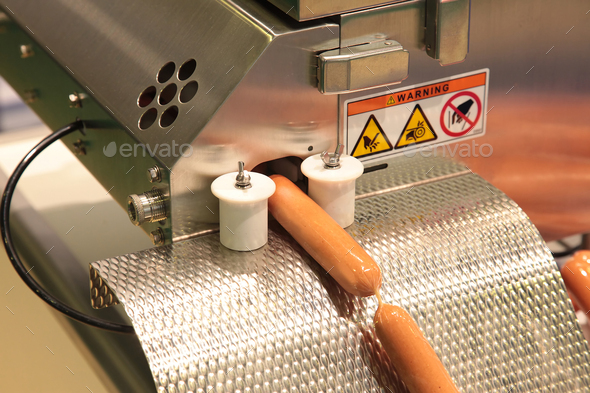 machine for packing sausages into a shell