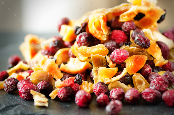 Mix of dried fruits on stone. Cranberry, rhubarb, apple, mango, cherry, peach, apricot. Handmade - Stock Photo - Images