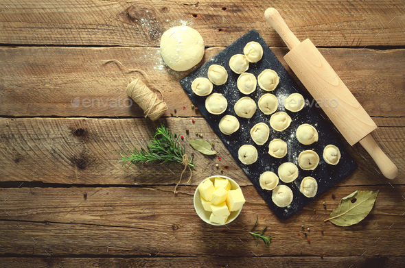 Ingredients for making pelmeni, ravioli, dumplings - dough, rosemary, rolling pin, canvas thread - Stock Photo - Images