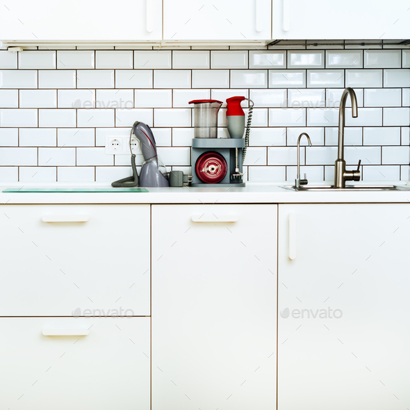 White interior design, modern and minimalist style kitchen with household appliances. Open space in - Stock Photo - Images