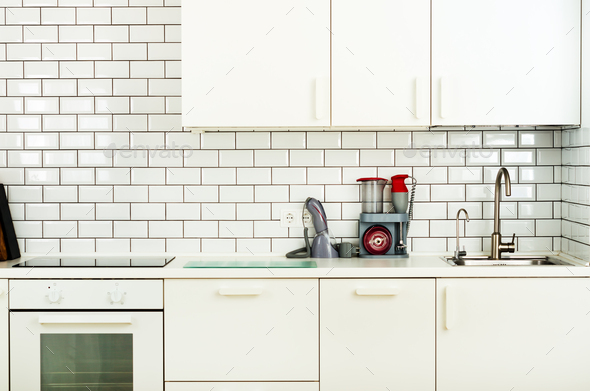 White minimalistic kitchen interior and design. Tile wall background. Household appliances - blender - Stock Photo - Images