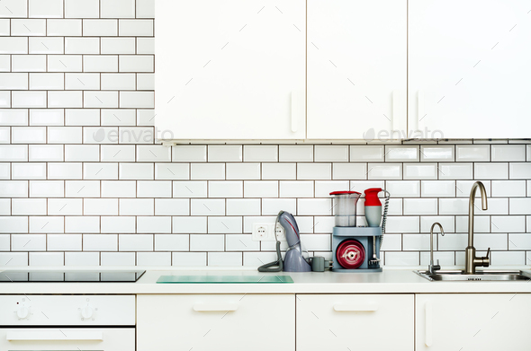 White interior design, modern and minimalist style kitchen with household appliances. Open space in - Stock Photo - Images