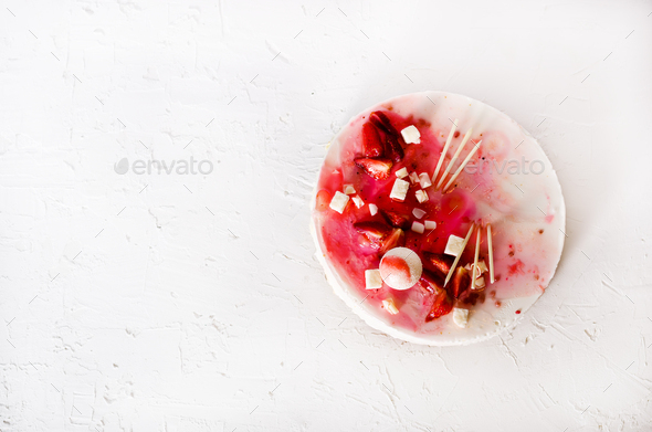 Delicious strawberry cheesecake, fresh berries, coconut, and sweet decor element on top, white - Stock Photo - Images