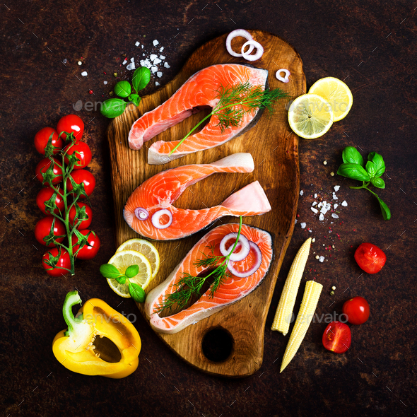 Salmon fillet, fish on wooden background with free space for your text. Top view. Healthy food, diet