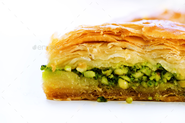 Baklava with pistachios, walnuts and honey on white background. Jewish, turkish, arabic traditional - Stock Photo - Images