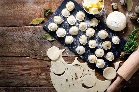 Ingredients for making pelmeni, ravioli, dumplings - dough, rosemary, rolling pin, canvas thread - Stock Photo - Images