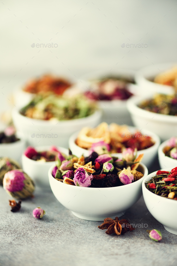 Assortment of dry tea in white bowls. Tea types backgound: green, black, floral, herbal, mint - Stock Photo - Images