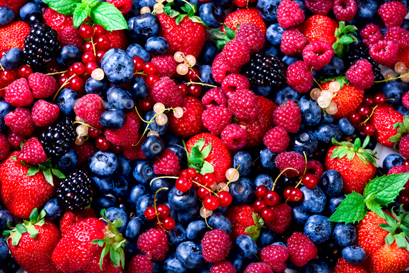 Macro colorful berries background. Top view. Summer food frame, border design. Assorted mix of - Stock Photo - Images