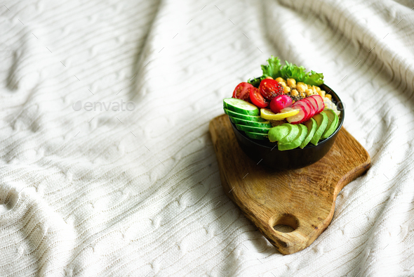 Buddha bowl with avocado, quinoa, cucumber, radish, salad, lemon, cherry tomatoes, chickpea, chia - Stock Photo - Images