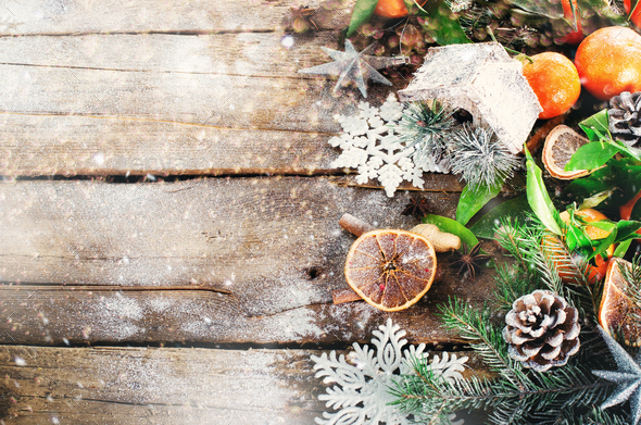 Magic Christmas background - vintage wood, candy cane, house, cinnamon, star anise, sweet mandarins - Stock Photo - Images