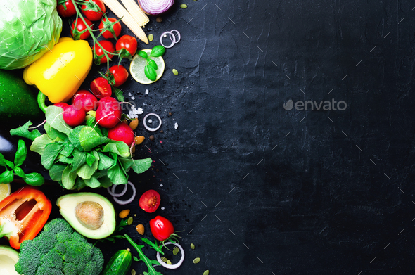 Set of fresh vegetables on a black background. Aromatic herbs, onion, avocado, broccoli, pepper bell - Stock Photo - Images