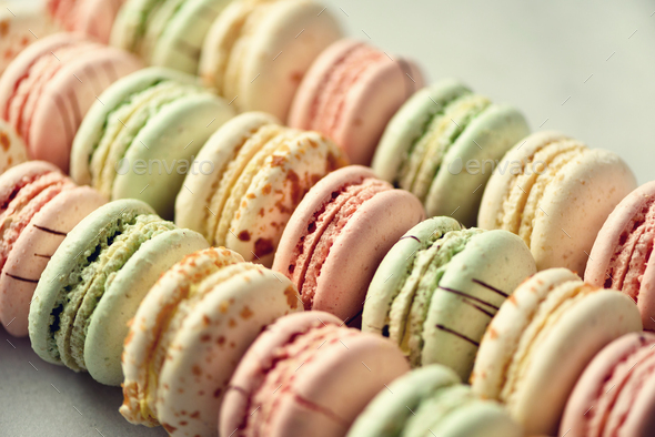 Colorful french macaroons flat lay. Pastel colors pink, green, yellow macarons with copy space, top - Stock Photo - Images