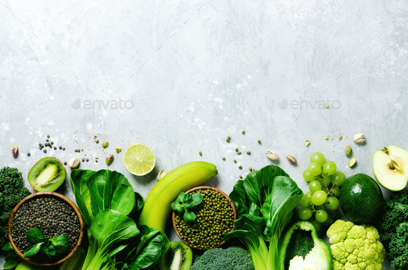 Organic green vegetables and fruits on grey background. Copy space, flat lay, top view. Green apple - Stock Photo - Images
