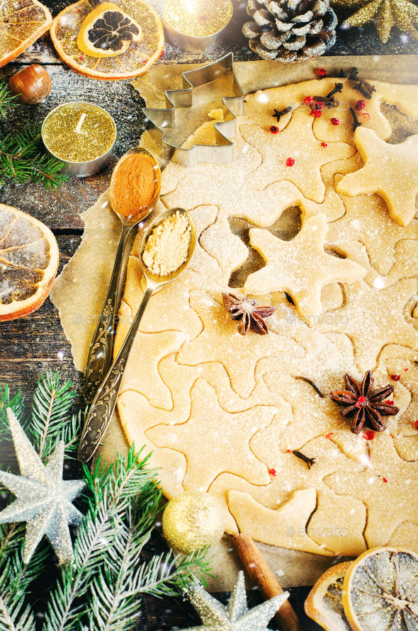 Ginger Bread Cookies. Christmas background with gifts, candle, cones, cinnamon sticks, dry orange - Stock Photo - Images