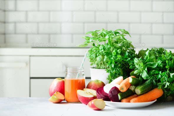 Fresh juice or smoothie, fruits and vegetable - apples, carrot, beet, celery, cucumber, greens - Stock Photo - Images