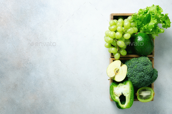 Organic green vegetables and fruits on grey background. Copy space, flat lay, top view. Green apple - Stock Photo - Images