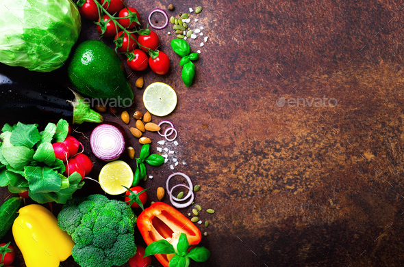 Set of fresh vegetables on brown background. Aromatic herbs, onion, avocado, broccoli, pepper bell - Stock Photo - Images
