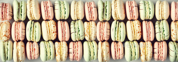 Colorful french macaroons flat lay. Pastel colors pink, green, yellow macarons with copy space, top - Stock Photo - Images