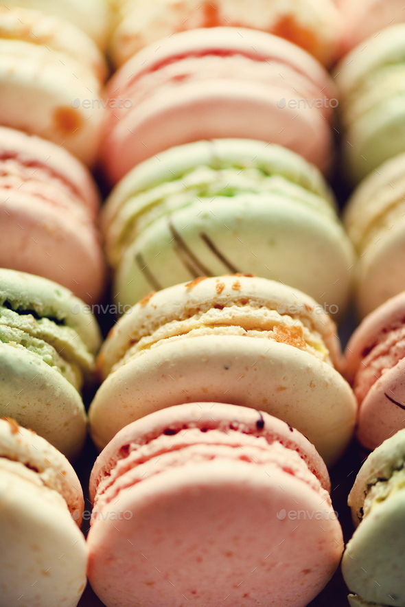 Colorful french macaroons flat lay. Pastel colors pink, green, yellow macarons with copy space, top - Stock Photo - Images