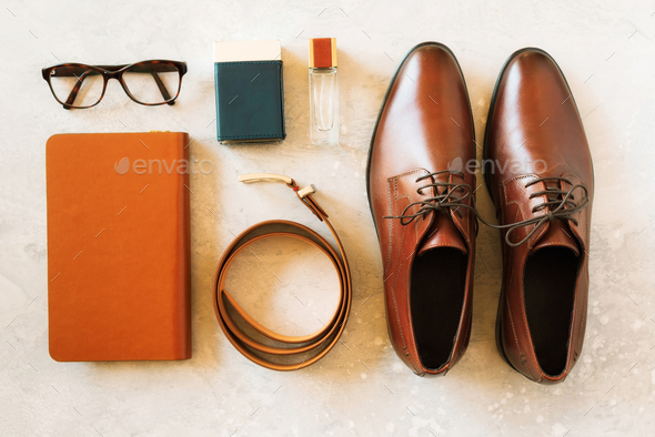 Set of stylish accessories for man on gray background. Flat lay of elegant belt, glasses, parfume - Stock Photo - Images
