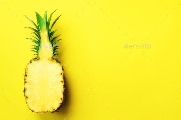 Half of sliced pineapple on yellow background. Top View. Copy Space. Bright pattern for minimal - Stock Photo - Images