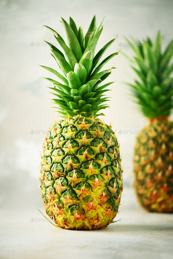 Tropical pineapples on gray background. Summer, holiday concept. Raw, vegan, vegetarian, clean - Stock Photo - Images