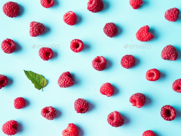 Raspberry pattern, blue background, top view - Stock Photo - Images