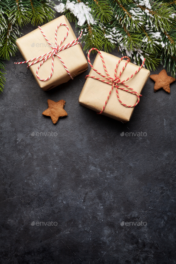 Christmas card with gift boxes and fir tree branch - Stock Photo - Images