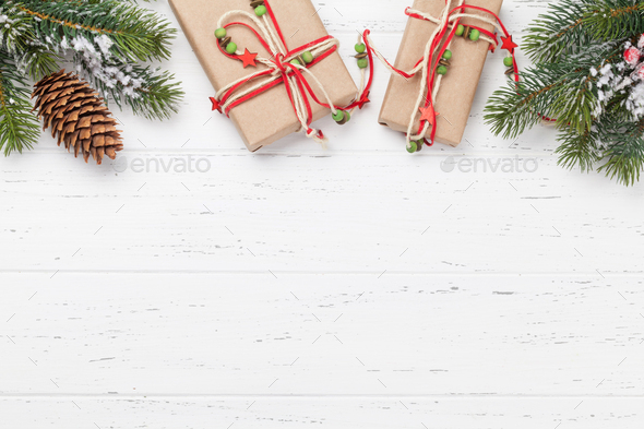 Christmas card with gift boxes and fir tree branch - Stock Photo - Images