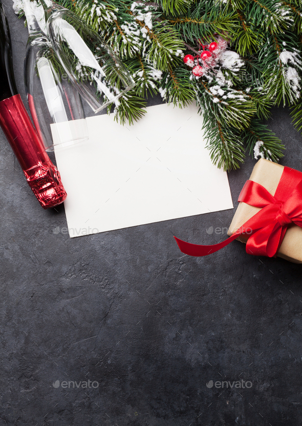 Christmas card with champagne and gift box - Stock Photo - Images