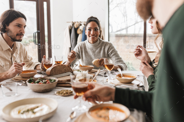 Group of young international friends having lunch in cafe - Stock Photo - Images