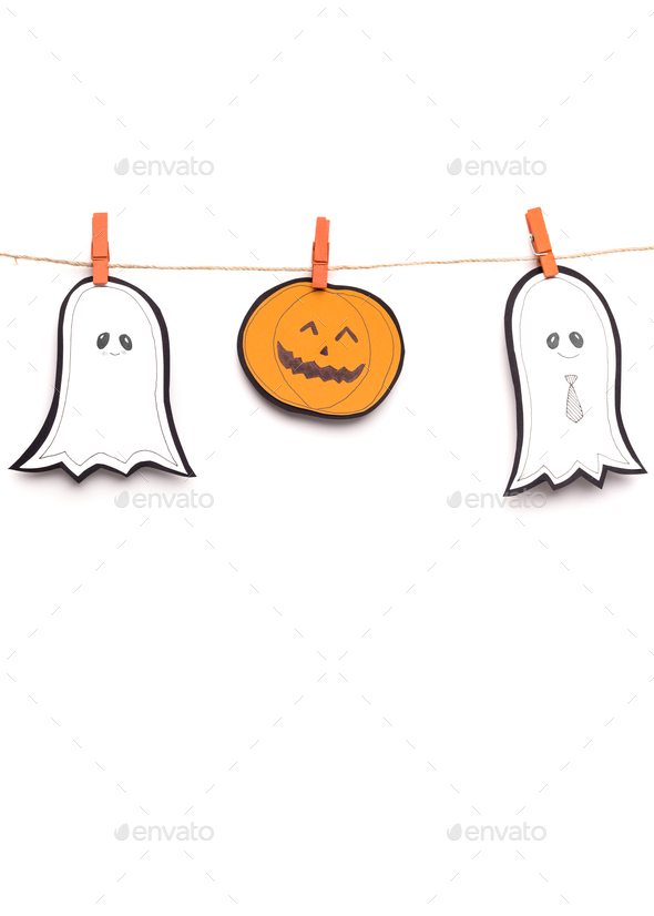 Close up of paper Halloween figures hanging out on rope
