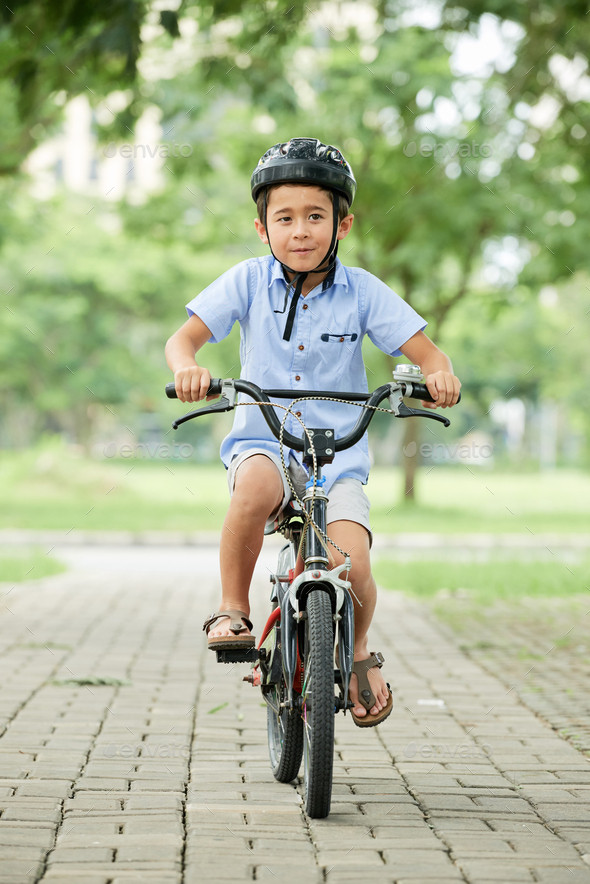 little boy riding bike