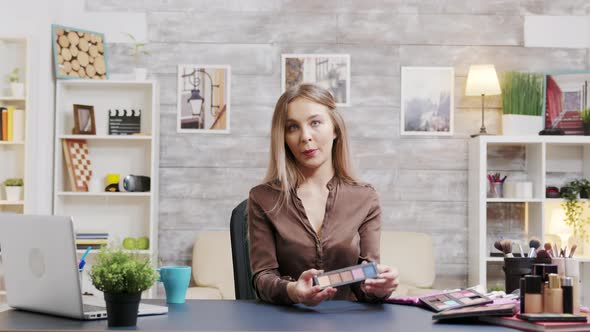 Beautiful Fashion Vlogger Presenting Different Skin Cosmetics alt