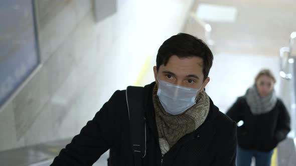 Sick Man in White Resperatory Mask in Usa or Europe. Novel Coronavirus Public. alt