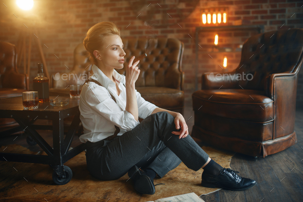 Business woman relax with whiskey and cigar - Stock Photo - Images