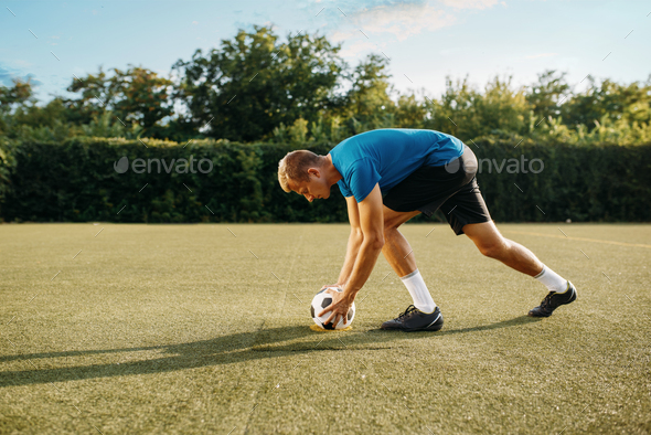 Male soccer player prepares to hits the ball - Stock Photo - Images