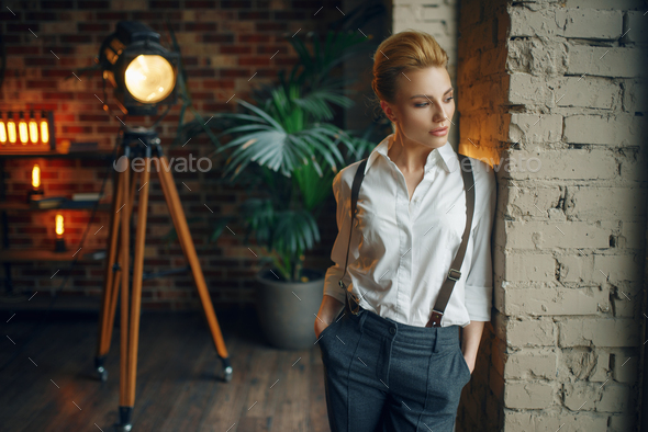 Business woman in strict clothes at the window - Stock Photo - Images