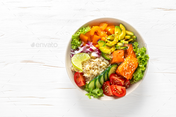 Buddha lunch bowl with grilled salmon fish, vegetables, lettuce salad and rice - Stock Photo - Images