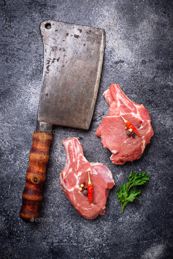 Raw meat and butchers knife - Stock Photo - Images