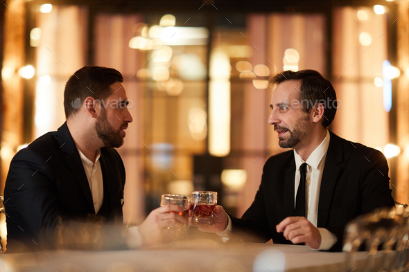 Two Business People Celebrating in Restaurant