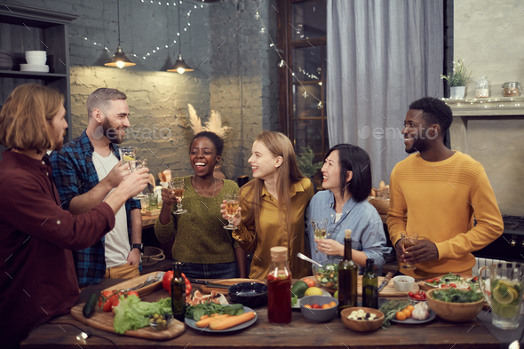 Diverse Group of Young People Enjoying Dinner Party