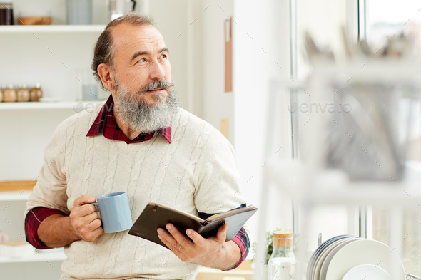 Bearded Senior Man Enjoying Morning Coffee